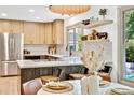 Bright kitchen with stainless appliances, light wood cabinets, island and eat in nook at 10016 Teton Ct, Lone Tree, CO 80124