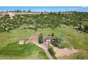 Aerial view of the home on a large lot in a beautiful country setting at 1151 Castlewood Pl, Franktown, CO 80116