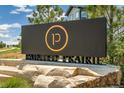 Painted Prairie community entrance sign on a stone base at 20590 E 58Th Ave, Aurora, CO 80019