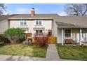 Charming two-story home with well-maintained lawn and inviting curb appeal at 6988 S Knolls Way, Centennial, CO 80122