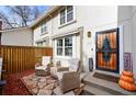 Inviting front porch with comfortable seating and charming curb appeal at 6988 S Knolls Way, Centennial, CO 80122