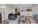 Open living room, dining area, and kitchen with modern appliances at 14602 E 2Nd Ave # 100C, Aurora, CO 80011