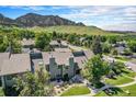Scenic aerial view of the townhouse nestled in a lush green neighborhood with a stunning mountain backdrop at 19 Benthaven Pl, Boulder, CO 80305
