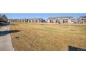 Picture of the golf course and some of the community buildings with water hazard for golfers at 2896 W Riverwalk Cir # A214, Littleton, CO 80123