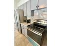 This kitchen features modern stainless steel appliances and ample counter space at 2814 S Winona Ct, Denver, CO 80236