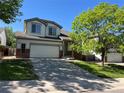 Charming two-story home with a two car garage and landscaped front yard at 20558 E Grand Ln, Aurora, CO 80015