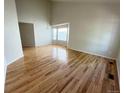 Bright living room featuring gleaming hardwood floors and a bay window at 20558 E Grand Ln, Aurora, CO 80015