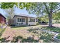 Charming single-story home with a well-maintained lawn and cozy front porch at 2684 S Logan St, Denver, CO 80210