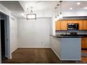 Open-concept dining area adjacent to the kitchen, offering ample space for entertaining at 8400 S Upham Way # E4, Littleton, CO 80128