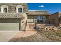 Charming two-story home showcasing a well-maintained lawn and a welcoming entrance at 7452 W Cedar Cir, Lakewood, CO 80226