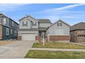 Charming two-story home with attached two car garage and manicured front yard at 14589 Hagus Pl, Parker, CO 80134