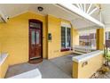 Inviting front porch with a hanging swing, perfect for relaxing and enjoying the neighborhood views at 1776 S Logan St, Denver, CO 80210