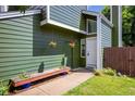 Home featuring a bench, hanging flower baskets, and a welcoming front entrance at 4129 Amber St, Boulder, CO 80304