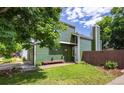 Home featuring well-maintained lawn, hanging flower baskets, and a welcoming entrance at 4129 Amber St, Boulder, CO 80304