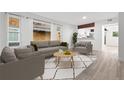 Bright living room with modern furniture, large windows, and stylish décor, creating a welcoming atmosphere at 1347 S Crystal Way, Aurora, CO 80012