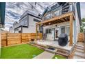 Private backyard oasis with a patio, outdoor seating, and a well-manicured lawn for relaxation at 3640 Lipan St, Denver, CO 80211