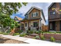 Beautiful exterior view with a manicured lawn, inviting porch, and a well-maintained facade at 3640 Lipan St, Denver, CO 80211