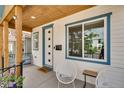 Inviting front porch with stylish seating, a welcoming vibe, and a well-lit entrance at 3640 Lipan St, Denver, CO 80211
