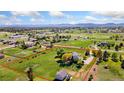 Aerial view of a large property with a home, outbuilding, and tree-lined perimeter at 15132 Pecos St, Broomfield, CO 80023