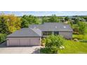 Charming home with a three car garage, well-manicured lawn, and mature trees at 15132 Pecos St, Broomfield, CO 80023