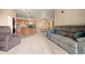 Living room and kitchen space with dining nook at 7212 S Blackhawk St # 1-103, Englewood, CO 80112