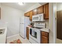 Functional kitchen equipped with essential appliances, ample cabinet space, and a clean, efficient layout at 519 Wright St # 106, Lakewood, CO 80228