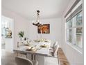Dining room with modern lighting, dining table with seating for six at 1206 E Phillips Pl, Littleton, CO 80122