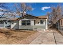 Charming single-story home featuring a combination of siding and stone accents at 116 S 10Th Ave, Brighton, CO 80601