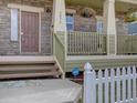 Close-up of a charming front porch with stone detailing and a welcoming entrance to the home at 5072 Meadow Mountain Dr, Broomfield, CO 80023