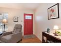 Inviting foyer with a red front door and tasteful decor at 2993 S Zenobia St, Denver, CO 80236