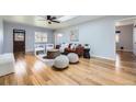 Cozy living room with skylight, wood floors, stylish furniture, and natural light at 1280 S Quitman St, Denver, CO 80219