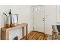 Inviting entryway features hardwood floors and a decorative table at 1665 Boston St, Aurora, CO 80010