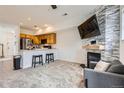 Inviting living space open to the kitchen with a fireplace and modern finishes at 2139 Coronado Pkwy # B, Denver, CO 80229