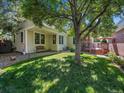 This backyard includes a spacious lawn and a deck that is perfect for outdoor entertaining at 5231 S Cody St, Littleton, CO 80123
