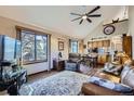 Cozy living room with a vaulted ceiling, large window, wood floors and comfortable seating at 6504 Ralston Rd # A, Arvada, CO 80002
