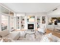 Inviting living room featuring a fireplace and built-in shelves at 2400 E Cherry Creek South Dr # 209, Denver, CO 80209