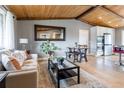 Open-concept space with hardwood floors, dining area, and a view of the modern kitchen at 13020 Julian Ct, Broomfield, CO 80020