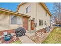 Inviting home exterior with a neatly landscaped yard and charming entryway, showcasing curb appeal at 3355 S Flower St # 107, Lakewood, CO 80227
