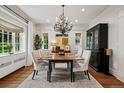 Bright dining room featuring a decorative chandelier, hardwood floors, and classic architectural details at 6300 E 17Th Avenue Pkwy, Denver, CO 80220