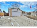 A well-maintained home with a spacious driveway and a two-car garage, set in a friendly neighborhood at 3863 S Bahama St, Aurora, CO 80013