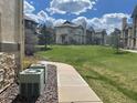 Townhome exteriors with lush green landscaping, creating an inviting and picturesque community setting at 7489 S Quail Cir # 814, Littleton, CO 80127