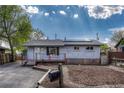 Charming single-story brick home featuring a well-maintained lawn, a new mailbox, and a welcoming front porch at 7541 Julian St, Westminster, CO 80030