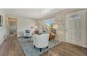 Inviting living room boasts hardwood floors, a bright window, and stylish furnishings for comfortable living at 7541 Julian St, Westminster, CO 80030