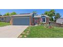 Charming single-Gathering home boasting a two-car garage, manicured lawn, and lovely curb appeal at 6085 S Parfet St, Littleton, CO 80127