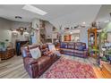 Open living room with high ceilings, skylights, and comfortable seating at 6085 S Parfet St, Littleton, CO 80127