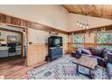 Comfortable living room with wood accents, large windows providing natural light, and inviting decor at 5739 Highway 9, Breckenridge, CO 80424