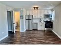 Bright kitchen featuring stainless steel appliances, white cabinets, and modern finishes at 1285 Colorado Blvd # 3, Denver, CO 80206