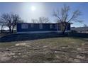 Exterior of home with siding and trimmed lawn at 7486 Patrick St, Fort Lupton, CO 80621