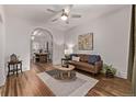 Inviting living room with hardwood floors, modern decor, and lots of light at 30 Fox St, Denver, CO 80223