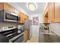 Modern kitchen featuring stainless steel appliances and sleek countertops at 252 N Pennsylvania St # 305, Denver, CO 80203